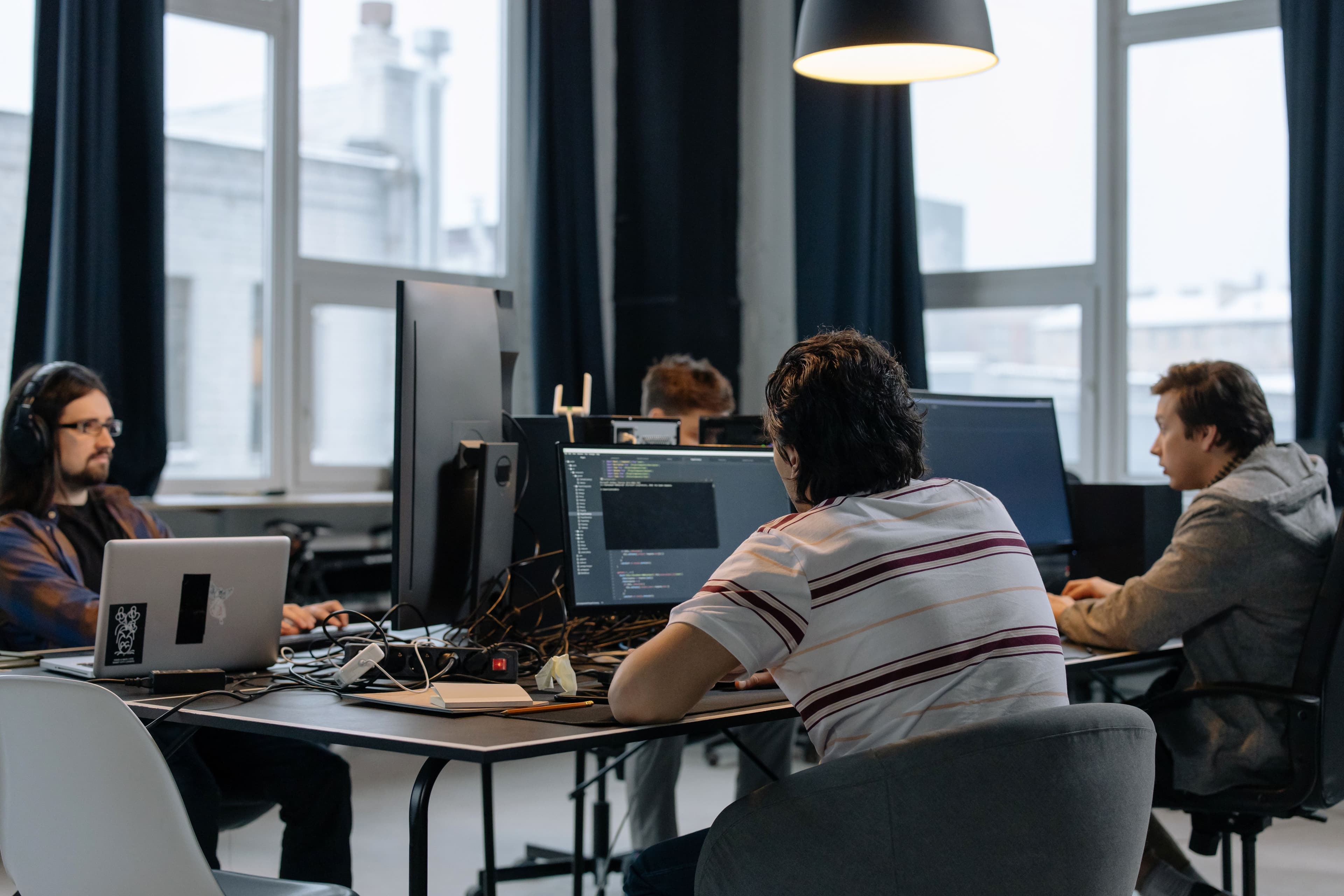 software engineering team collaborating office technology