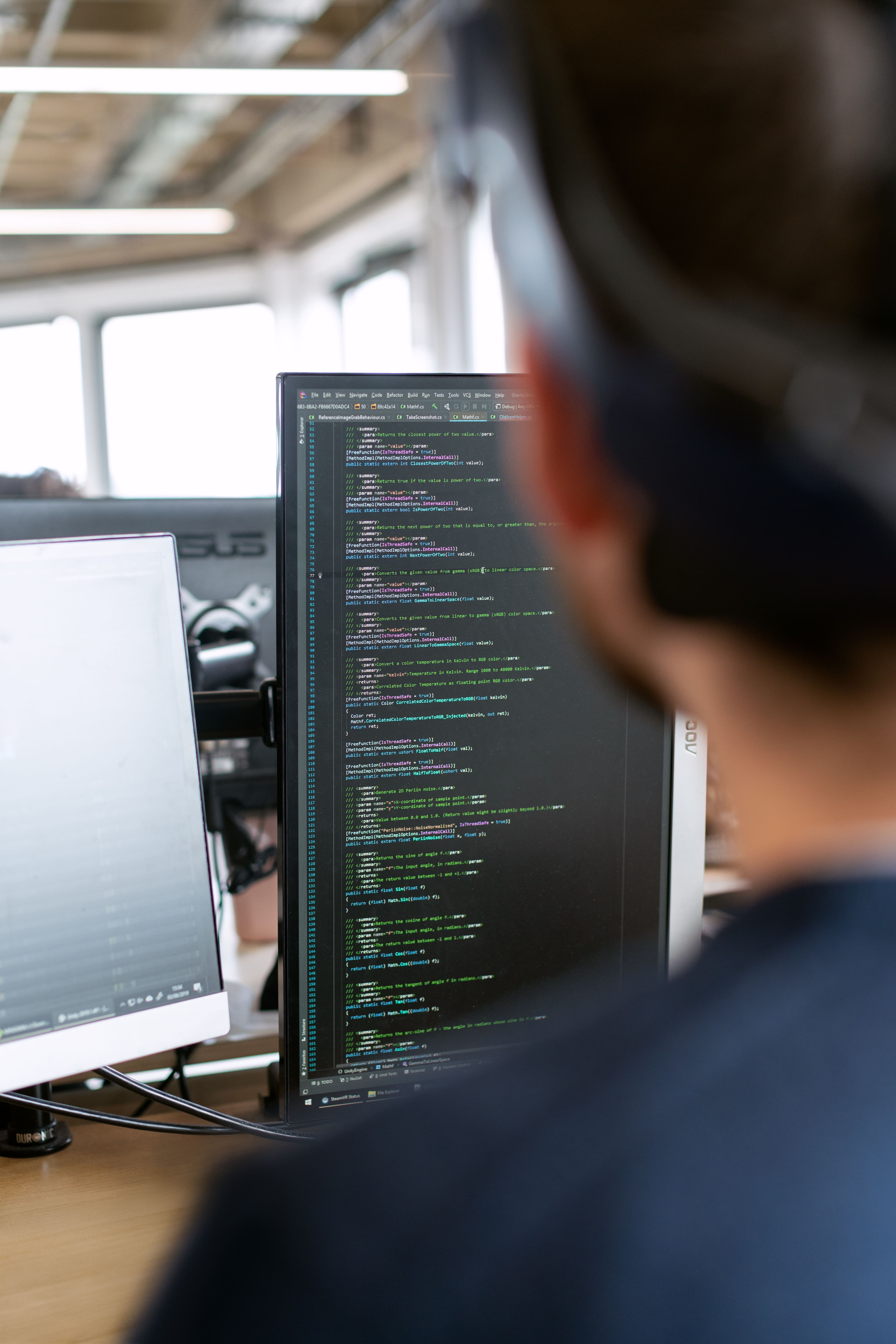 python developer coding modern office workspace